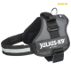 Schwarzes Julius-K9 IDC Power Hundegeschirr mit reflektierenden Streifen und einem Metall-D-Ring zur Leinenbefestigung.