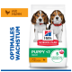 Hill's Science Plan Welpenfuttersack 'PUPPY <1 MEDIUM with Chicken'; zwei Welpen; Text 'Optimales Wachstum' und 5 Vorteile.