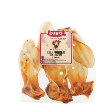 Oreilles de boeuf séchées avec coquilles, emballées dans un sac transparent, avec une étiquette indiquant "DIBO 100% schonend getrocknete Rinderohren mit Muschel 5 Stück."