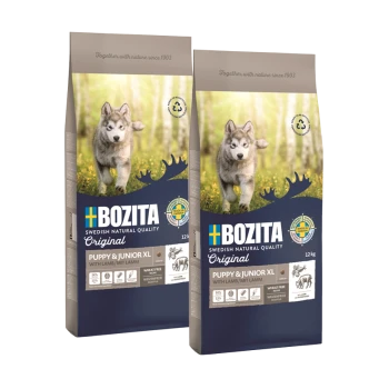 Zwei Beutel Bozita Hundefutter, beschriftet mit "Original Puppy & Junior XL mit Lamm," mit einem verspielten Welpen auf der Vorderseite, jeweils 12 kg.