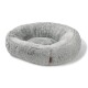 Graues, rundes Plüsch-Haustierbett mit erhöhten Rändern und kleinem braunem Etikett an der Seite, auf weißem Hintergrund.