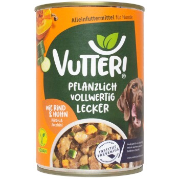 Dose mit Vutteri veganem Hundefutter, die einen braunen Hund auf dem Etikett zeigt, mit dem Text "Pflanzlich Vollwertig Lecker" und "Wie Rind & Huhn".