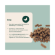 Braune Entenpellets neben einer deutschen Infokarte mit der Überschrift 'Ente', die Muskelunterstützung, Preiselbeeren, Antioxidantien und Yucca erwähnt.