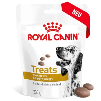 Verpackung von Royal Canin Hundeleckerlis mit einem Bild eines schwarz-weißen Hundes, beschriftet mit "Kompatibel mit Urinary S/O Diäten", 230g.