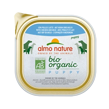 Almo Nature Bio-Welpenfutterdose mit goldenem Rand, Hundillustrationen und Text: "mit Huhn und Milch" und "gehört den Tieren."