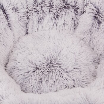 Flauschiges weißes Haustierbett mit einem runden Kissen, mit weichem, langem Felltextur, ideal für kleine Tiere, um bequem zu ruhen.