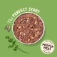 Kom met hondenvoer met gemalen vlees en stukjes, met de tekst 'The Perfect Start' en 'PROPER MEAT - nooit vleesmeel' op een groene achtergrond.