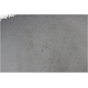 Nahaufnahme einer strukturierten Oberfläche, die feinem Sand oder Pulver ähnelt, mit einer Mischung aus hellen und dunklen Flecken.