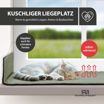 Katze schläft auf einem selbstwärmenden, faltbaren Fensterplatz mit der Aufschrift "Kuschliger Liegeplatz" zum gemütlichen Ausruhen und Beobachten.