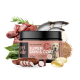 Ein schwarzes Glas mit der Aufschrift "petstile Dog Superfoods SUPER SKIN & COAT 100g", umgeben von frischem Fisch, Fleisch, Algen und Nahrungsergänzungsmitteln.