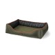 Olive green pet bed with a quilted bottom and a camouflage-patterned interior, featuring orange piping and a logo tag.
