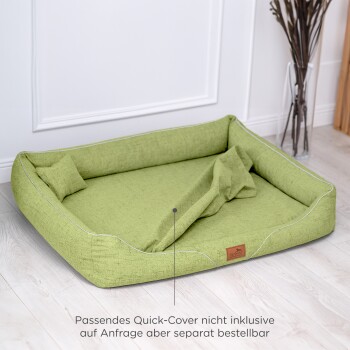 Grünes Haustierbett mit erhöhten Rändern und einem weichen Inneren, mit einem Etikett, das "le chien" liest und Text über eine separate Quick-Cover enthält.