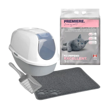 Eine graue und weiße Katzenstreu-Box, Schaufel, Pfotenmatte und 12 kg Premiere Katzenstreu-Sack mit einer grauen Katze auf der Verpackung.