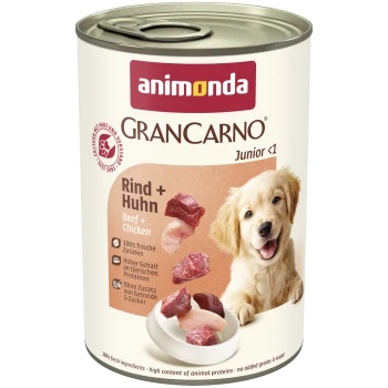 Dose Animonda GranCarno Junior <1 Nassfutter für Hunde, Aufschrift 'Rind + Huhn', zeigt Fleischstücke und einen Welpen.