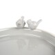 A light gray pet bowl with two decorative bird figurines perched on the rim, reflecting a modern and stylish design.