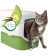 Eine graue Katze mit grünen Augen sitzt neben einer Katzentoilette, die eine Melonenscheibe und eine Vanilleblume zeigt, beschriftet mit "Vanille & Melone."