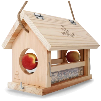 Holz-Vogelfutterspender mit einem geneigten Dach, das zwei Äpfel an den Seiten und ein transparentes Fach mit Samen enthält.