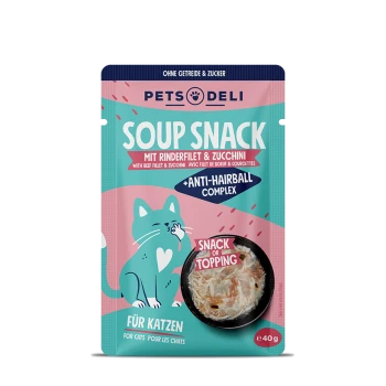 Tierfutterverpackung mit einem Suppensnack für Katzen mit Rinderfilet und Zucchini, beschriftet mit "Anti-Haarball-Komplex" und einem Serviervorschlag.