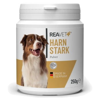 Behälter mit REAVET HARN STARK Pulver für Hunde, mit einem lächelnden Hund auf dem Etikett, mit dem Text "Hergestellt in Deutschland" und 250g.