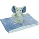 A soft, plush green elephant toy stands on a light blue blanket, showcasing its large ears and stitched features.