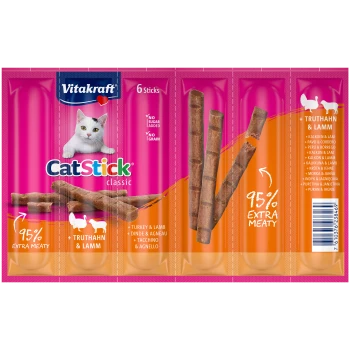 Emballage Vitakraft CatStick classique mettant en vedette un chat blanc joueur, avec 6 bâtonnets de viande. Le texte met en avant "95% Extra Meaty" et "Sans sucre ajouté."