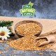 Eine Holzschüssel mit Samen, die auf eine strukturierte Oberfläche mit einer Schaufel, einer Blume und Grünzeug fällt, mit "LYRA NATURE POWER" in blättrigem Text.