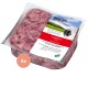 Verpackung für Hundefutter mit Geflügel von proCani, mit einem pinken Fleischblock in einer klaren Schale, auf Deutsch beschriftet mit einem grünen Logo.