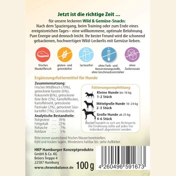 Verpackung von Hundesnacks mit 'Wild & Gemüse-Snacks' und Zutaten wie Wildfleisch, Karotten und Kokosmehl; gluten- und laktosefrei.