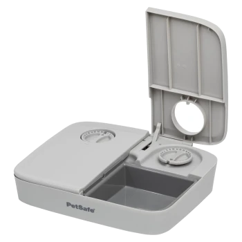 PetSafe automatischer Futterspender für Haustiere mit grauem Design, ausgestattet mit zwei Timer-Drehreglern und einem abnehmbaren Futterbehälter.