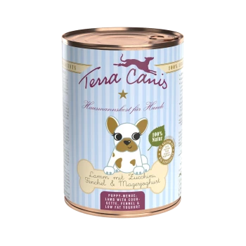 Dose Hundefutter mit der Aufschrift "Terra Canis", die einen Cartoon-Hund zeigt, mit dem Text "Lamm mit Zucchini, Fenchel & Magerjoghurt" und "Welpen-Menü."