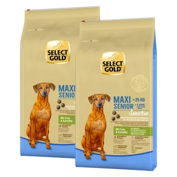 Deux sacs de nourriture pour chiens Select Gold étiquetés "MAXI SENIOR" pour les chiens de plus de 25 kg, contenant des ingrédients de canard et de pomme de terre.