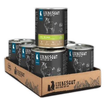 LIEBESGUT Hundefutter-Sechserpack im Kartontray, schwarze Dosen mit Aufschriften "LIEBESGUT", "Ziege für Hunde" und "Sensitiv"