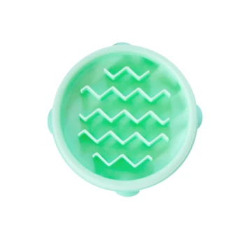 Eine Draufsicht auf eine hellgrüne Silikon-Haustierpflegebürste mit Zickzack-Rillen, die zum Reinigen und Massieren von Haustieren entwickelt wurde.