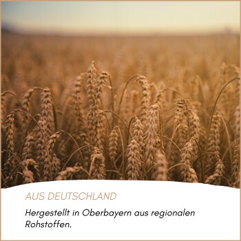 Sonnenblumenfeld bei Sonnenuntergang mit deutschem Text über regionale Lebensmittelzutaten aus Oberbayern und Bruckmühl.