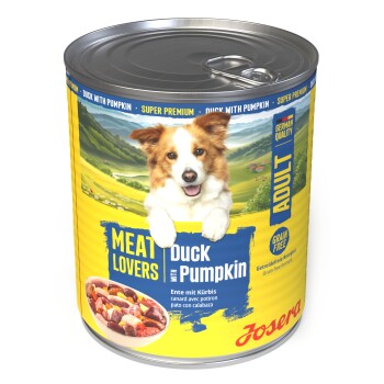 Dose Josera 'Meat Lovers' Hundefutter, 'Duck with Pumpkin' (Adult, grain‑free) mit lachendem Hund auf dem Etikett.