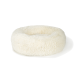Lit pour animaux moelleux de forme ronde, conçu pour le confort et la détente.