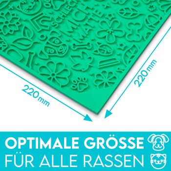 Grüne Silikon-Tiermatte (220mm x 220mm) mit geprägten Designs von Blumen, Knochen und Tiergesichtern. Text: 'OPTIMALE GRÖSSE FÜR ALLE RASSEN.'