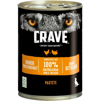 Dosen-Hundefutter mit dem Etikett "CRAVE", das das Gesicht eines Wolfes zeigt, mit dem Fokus auf hohem Protein, 100% natürlichem Huhn und Truthahn sowie getreidefrei.