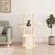 Ein gemütliches Wohnzimmer mit einem beigen Katzenbaum, auf dem eine getigerte Katze sitzt, einem grünen Sofa und einer Topfpflanze.