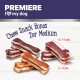Premiere I ❤️ meinen Hund-Logo über einer Anzeige von mittelgroßen Kausnacks, die etwa 11 cm und 4 cm messen, auf einem weißen Holz-Hintergrund.