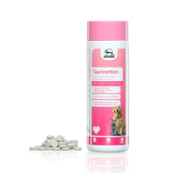 Supplementbehälter mit der Aufschrift "Taurinetten" für Hunde und Katzen, mit einem Golden Retriever und einer Katze auf der Vorderseite, neben denen Tabletten liegen.