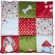 Colorful pet bed with a patchwork design featuring a dog, a bone, hearts, and a doghouse, in shades of red, green, and blue.