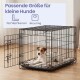 Kleiner Jack Russell in einem schwarzen Draht-Hundekäfig; Einblendtext: 'Passende Größe für kleine Hunde' und 'Bis zu 11 kg'.