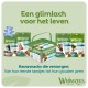 Whimzees tandverzorgende hondensnacks: verpakking en pot op groene achtergrond, kop 'Een glimlach voor het leven'