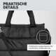 Schwarze Transporttasche für Haustiere mit gepolsterten Griffen und praktischem Außentasche für Leckerlis und Kotbeutel, Text auf Deutsch.
