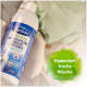 Bactador 1 L Flasche mikrobiologische Wäschespülung neben gefalteter Strickware; grüner Etikettentext 'Hygienisch frische Wäsche'.