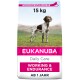 Eukanuba Daily Care Hundefutter Tasche, 15 kg, mit einem gescheckten Hund auf einer grasbewachsenen Fläche. Text hebt "Arbeiten & Ausdauer" und "AB 1 Jahr" hervor.