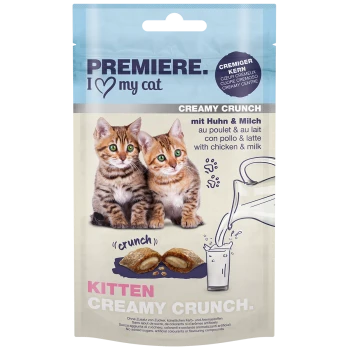 Zwei verspielte Kätzchen mit grünen Augen auf einer Haustierfutterverpackung, beschriftet mit "Premiere. I ❤️ my cat Creamy Crunch" mit Huhn- und Milchgeschmack.