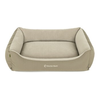 Ein beiges Haustierbett mit erhöhten Seiten und einem weichen Kissen, mit dem Logo "Doctor Bark" auf der Vorderseite.