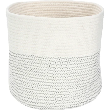 Ein runder, geflochtener Aufbewahrungskorb mit einer cremefarbenen Oberseite und einem Zickzack-Muster in Schwarz auf der unteren Hälfte, geeignet für Haustierbedarf.